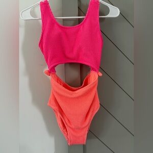 One piece bathing suit with cut out middle and back